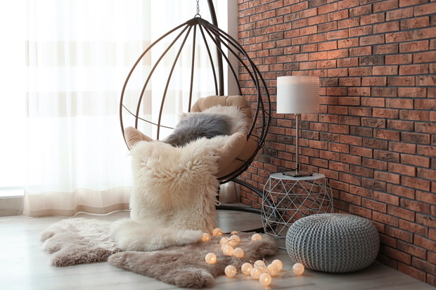 Comfortable hanging chair in modern living room interior