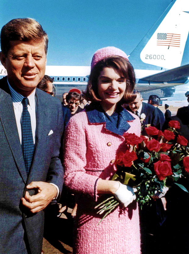 President John Kennedy and his wife Jackie, wearing strawberry-pink Chanel suit , arriving at Dallas airport (the day of John's assassination) November 22, 1963