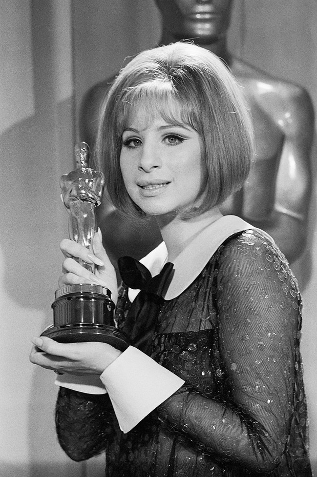 Barbra Streisand Holding Academy Award