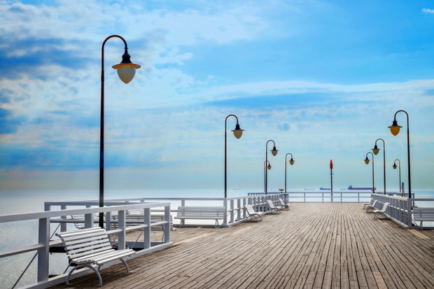 Pier with empty benches in Gdynia Orlowo, Poland. Travel destina