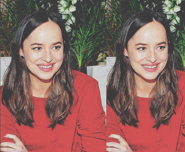 dakota johnson w czerwonej tunice i czerwonych spodniach
