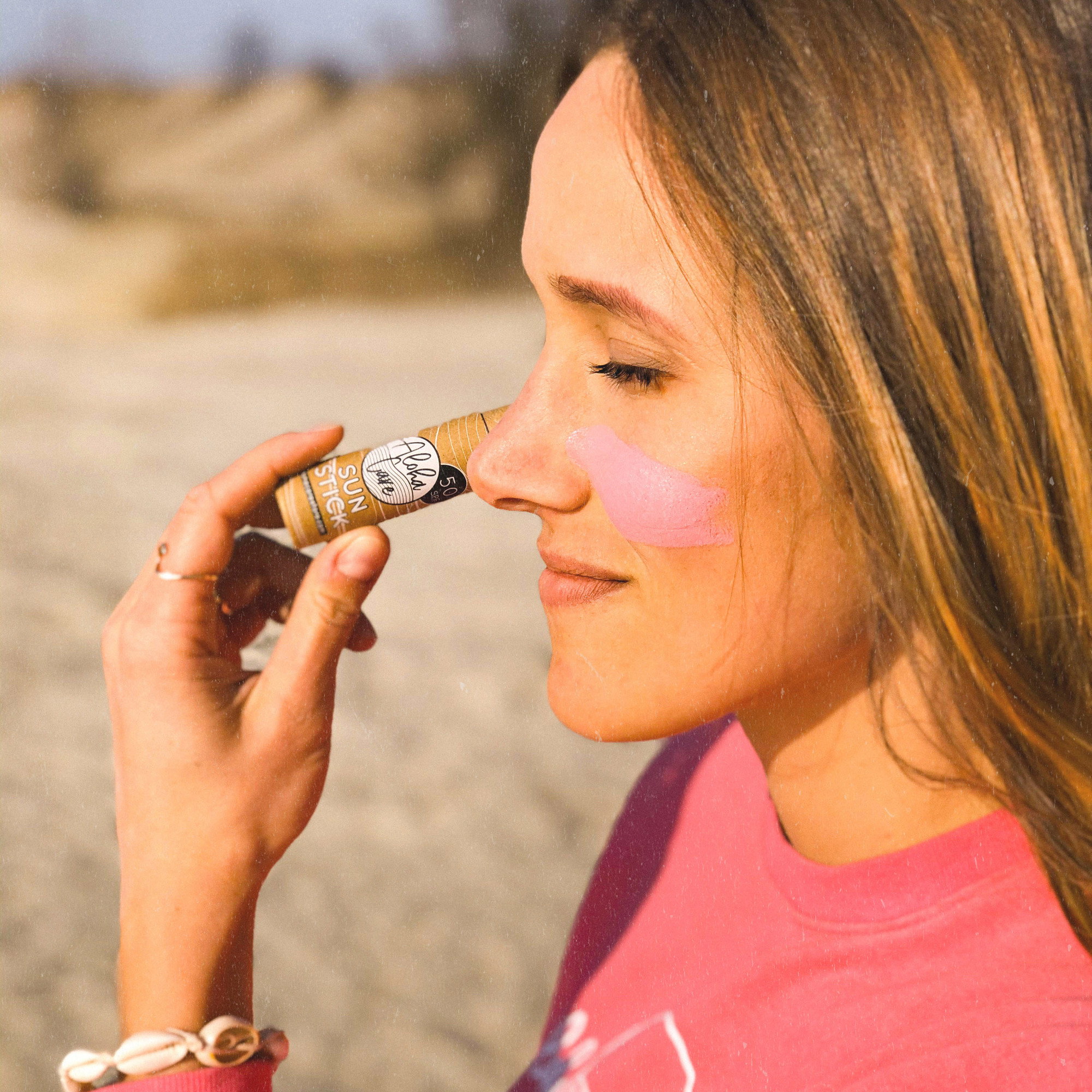 Aloha Sun Stick Pink on face