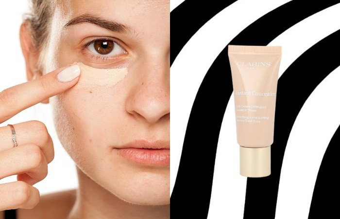 Kobieta nakładająca korektor pod oczy/korektor Clarins Instant