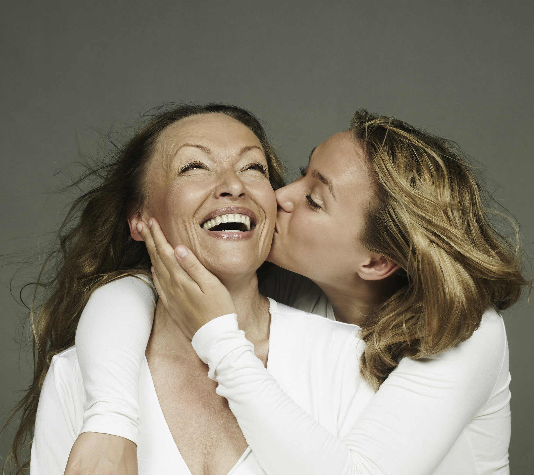 Portrait of daughter kissing her mother