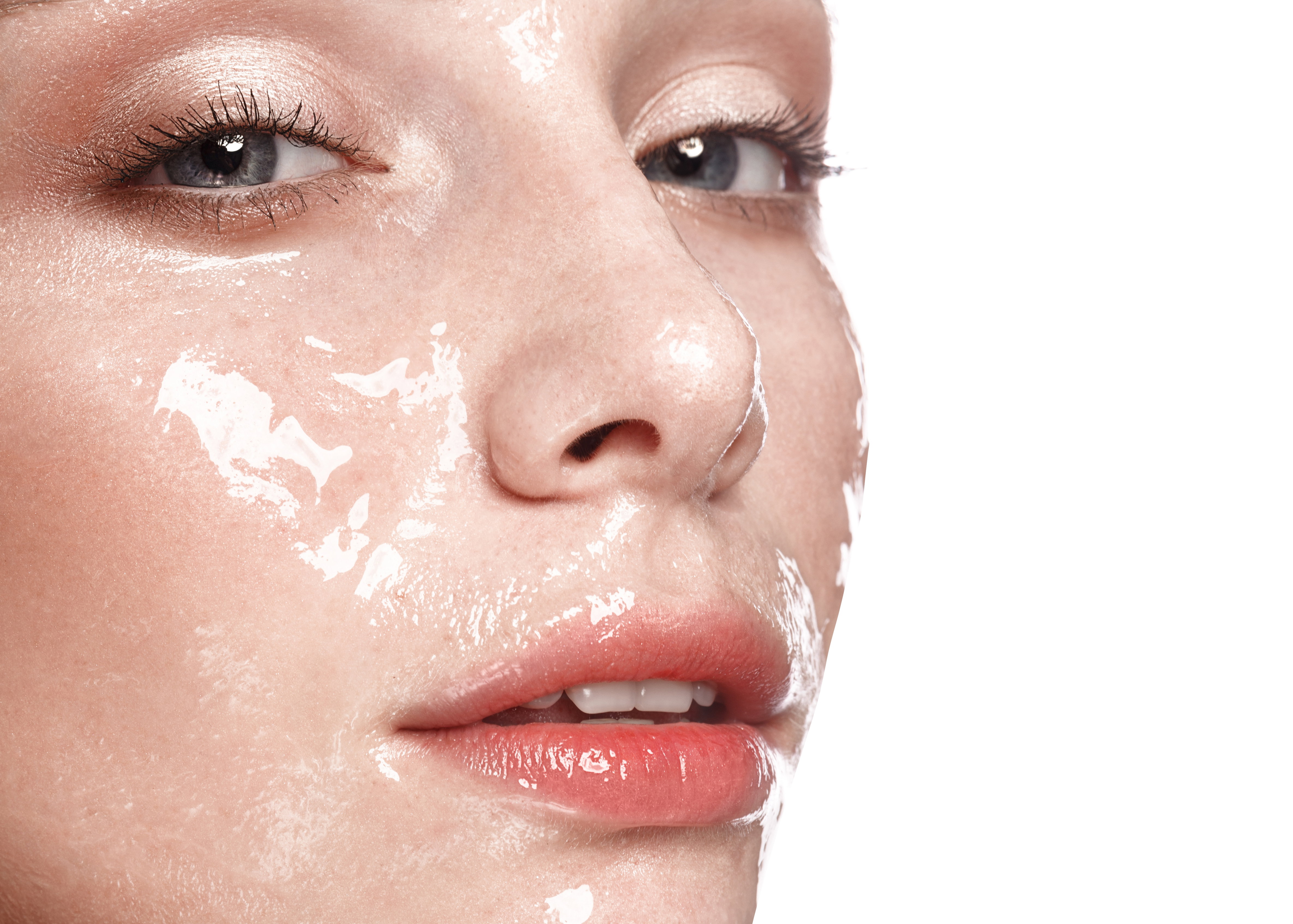 Beautiful young girl with a light natural make-up and perfect wet skin. Beauty face.